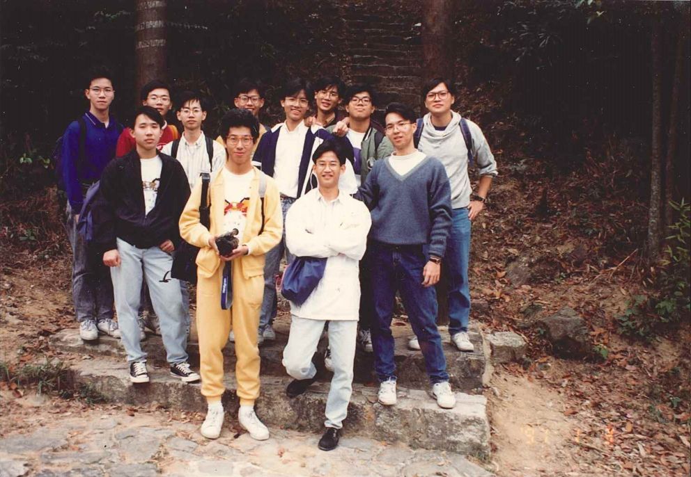 A photo of Mr Ricky Chong (first from the right, second row) with classmates during hiking